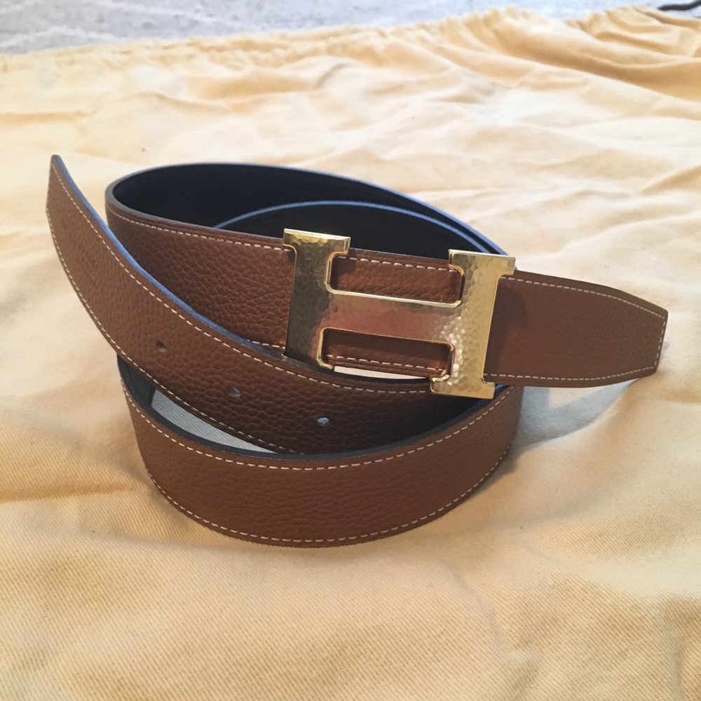 Men’s Hermès belt. Gold buckle and tan/black belt